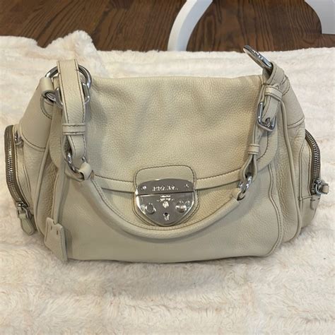 prada genuine black pebbled leather bag lock and key